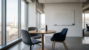 Small meeting table with empty chairs beside a blank whiteboard, illustrating an LLC member dispute